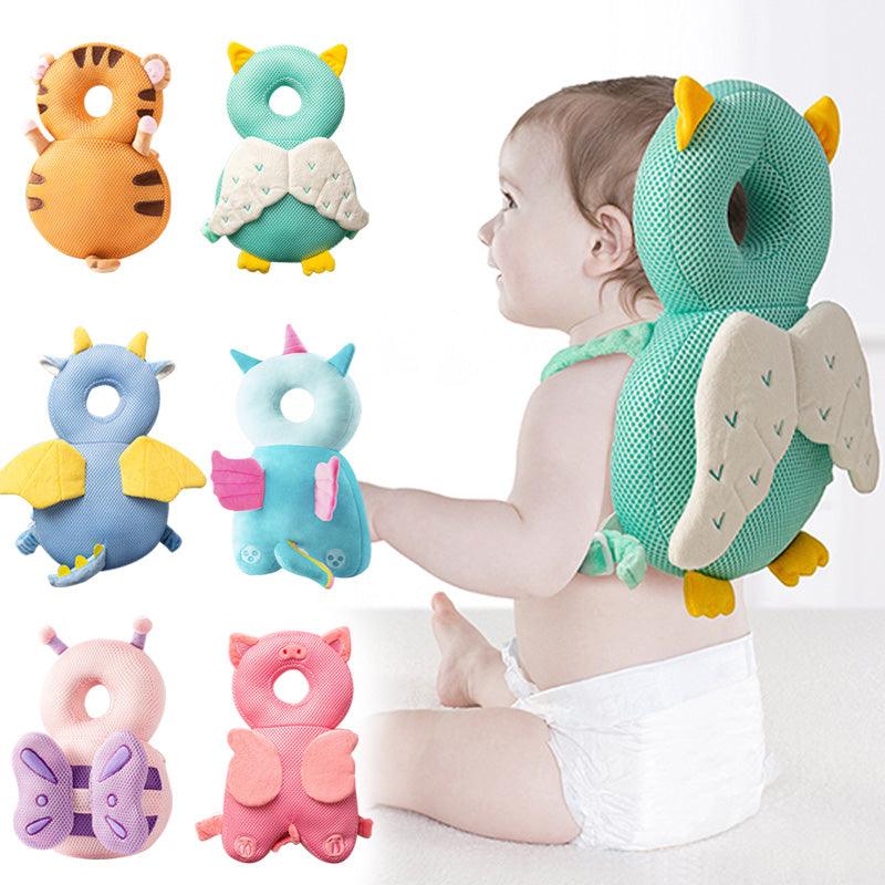 Animal-style baby head cushion backpack variants beside a baby wearing the green owl design
